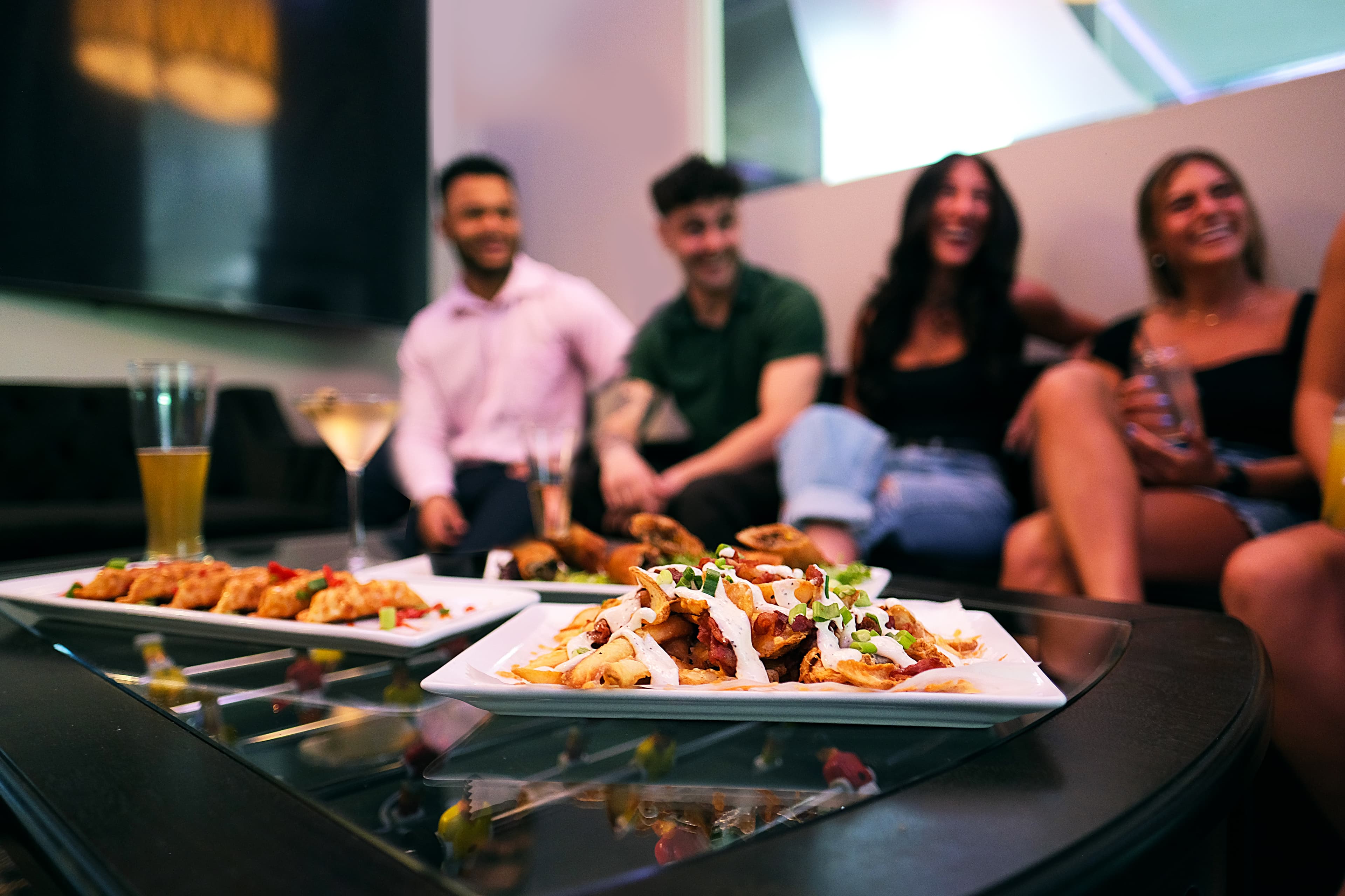 Guests enjoying food and drinks at The Bunker